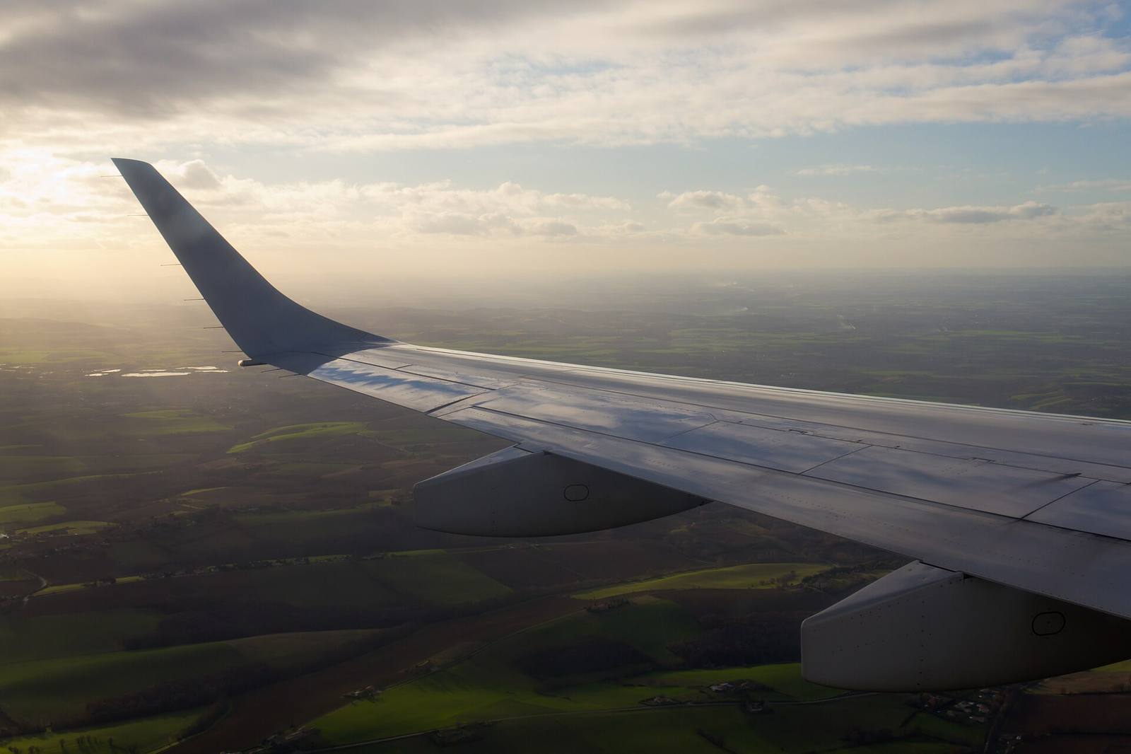 Airplane wing at sunset